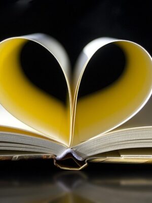 pages of a notebook curled in a heart